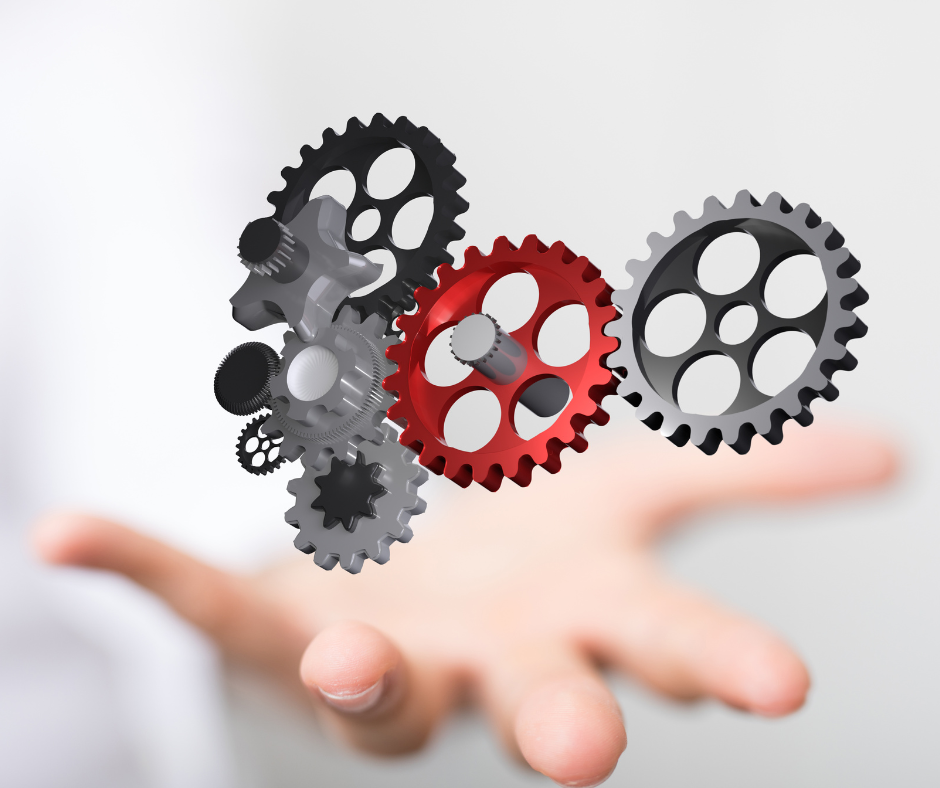 Gears working together to power a machine or idea, like HubSpot's various hubs